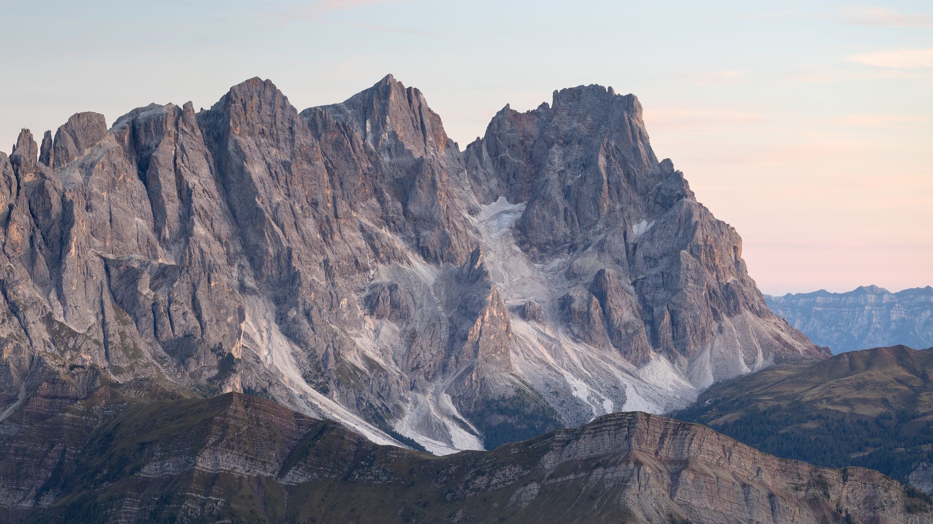 Dramatic limestone peaks of the Italian Dolomites at sunset