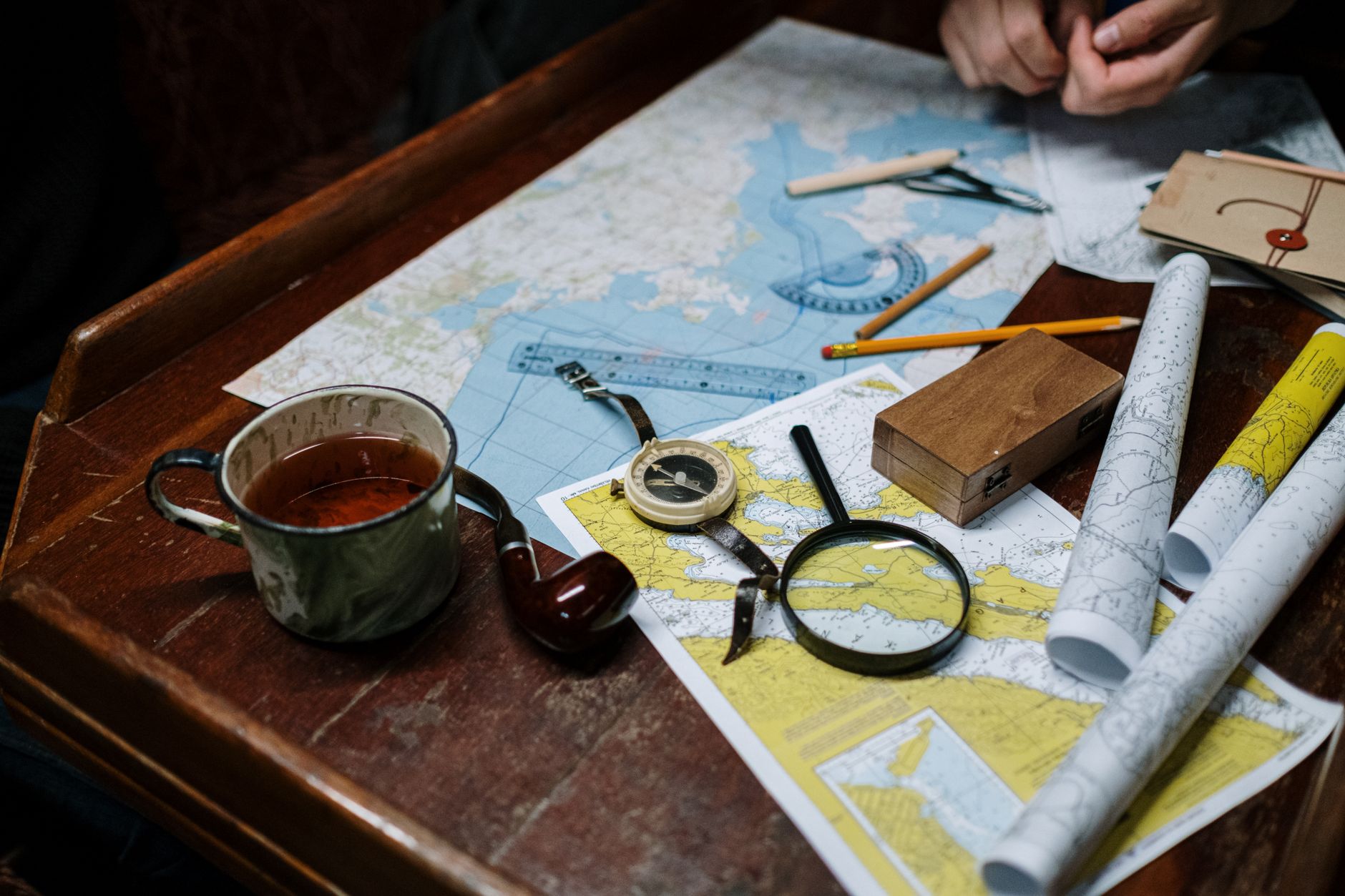 Custom route map with vintage compass on linen table