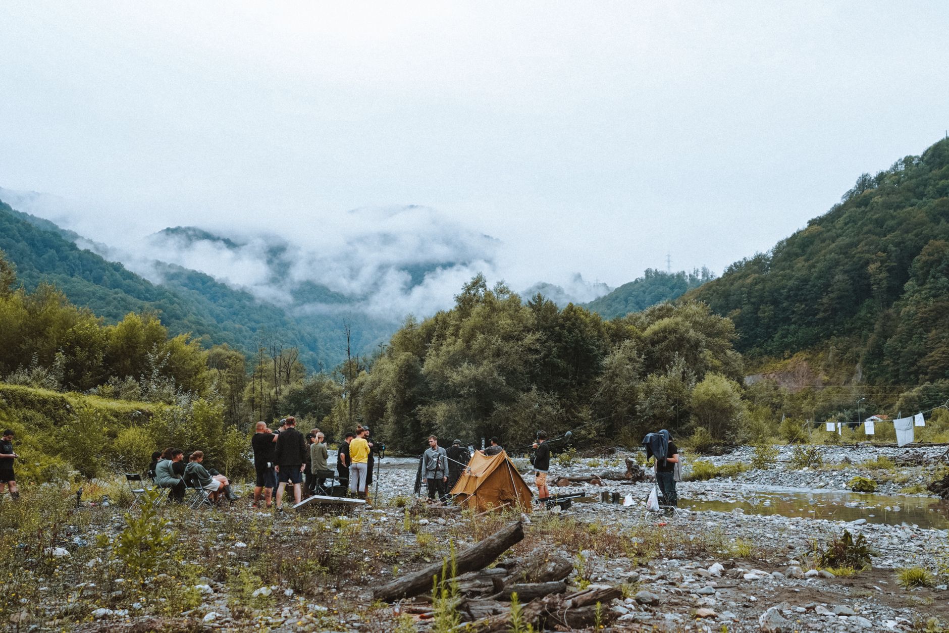 Editorial photography crew in a misty forest